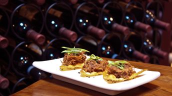 Slow-Roasted Hoisin Duck on Crispy Wontons